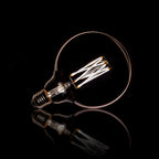 Ampoule LED à filament G125 globe diamètre 12,5 cm - E27, verre gris fumé, 2100K